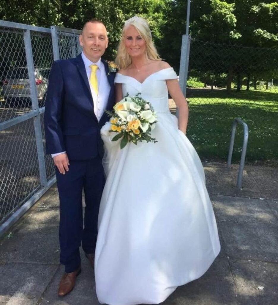 Heavily pregnant bride wearing altered satin wedding dress in Surrey