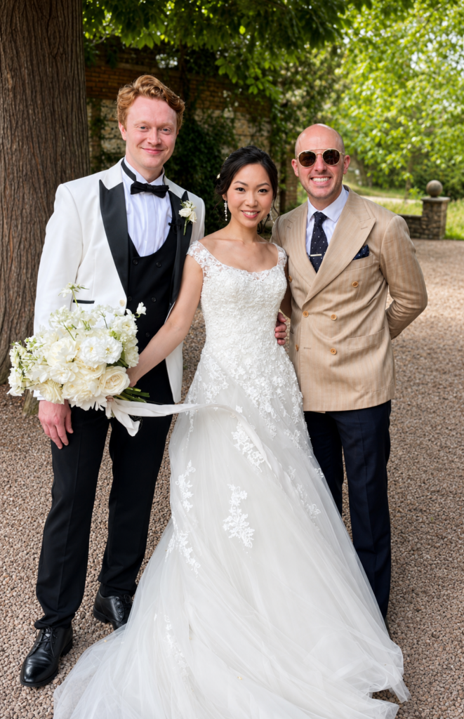 Bride wearing altered Riki Dalal wedding dress with bridesmaids at Birtsmorton Court wedding