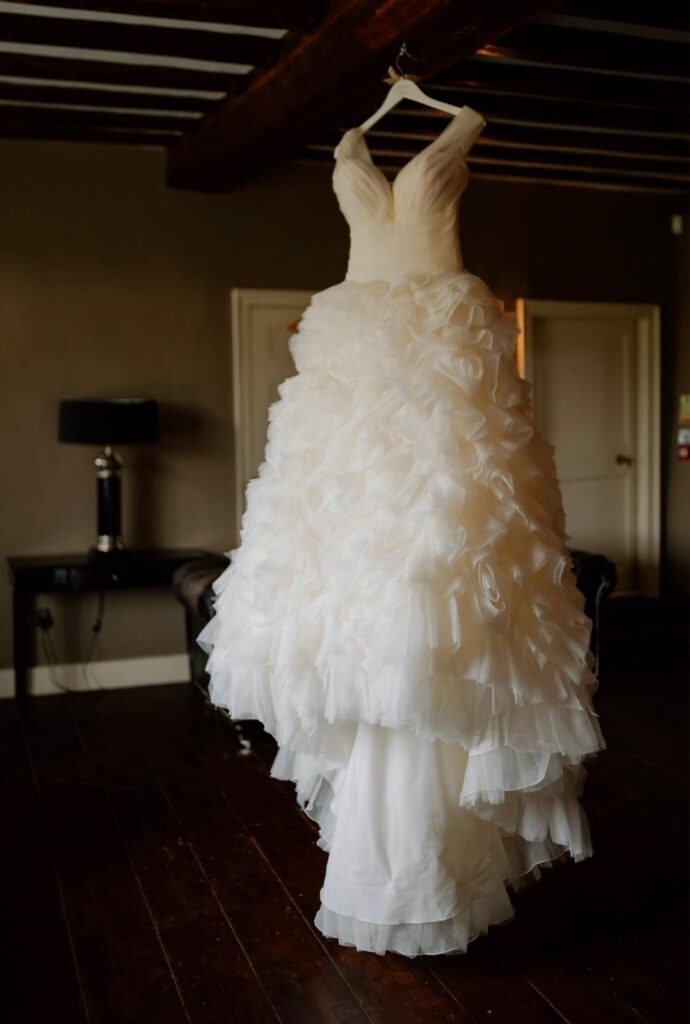Ronald Joyce bridal gown with dramatic layered organza skirt before final bridal fitting