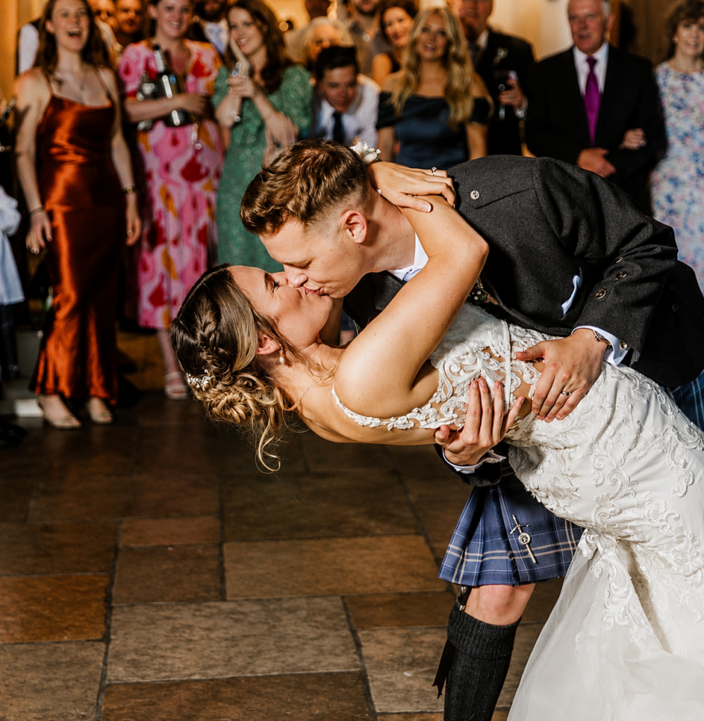 bride and groom kissing happily