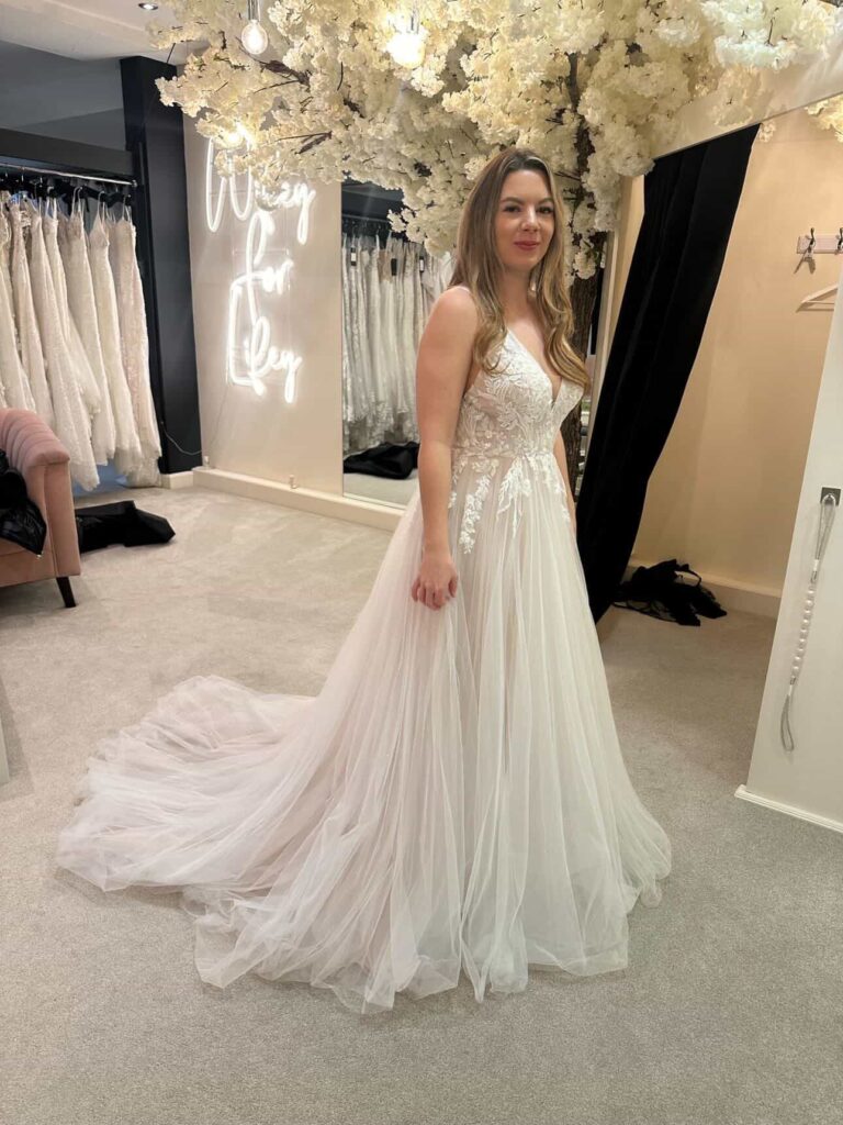  Bride in unaltered Stella York wedding dress front view
