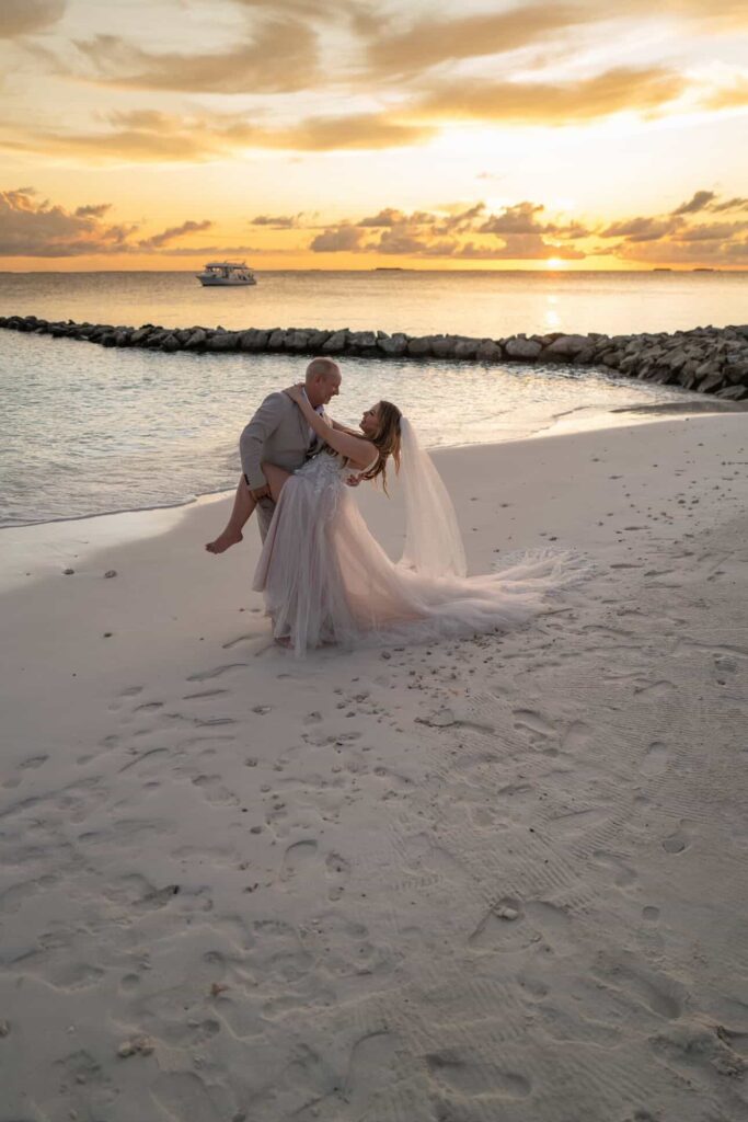 Bride and groom Walking with cathedral veil flying