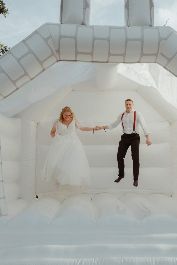 Bride wearing altered WED2B wedding dress while celebrating comfortably at wedding reception