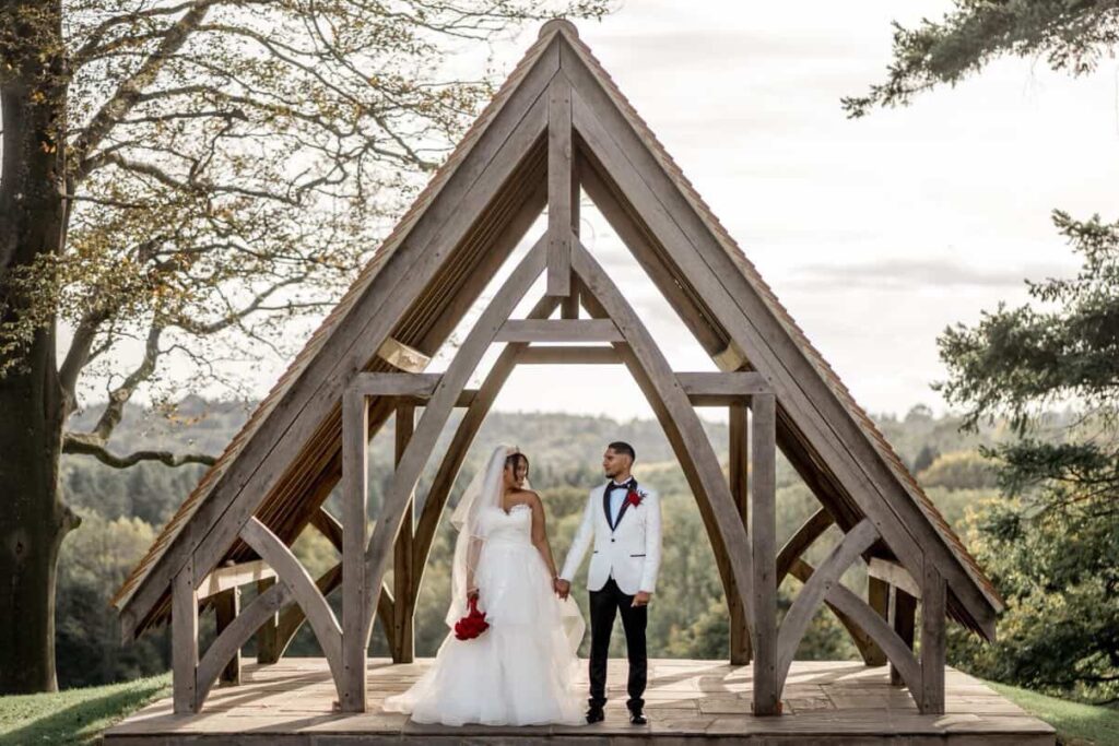 Bride wearing altered WED2B wedding dress with couture modesty panel and reconstructed neckline