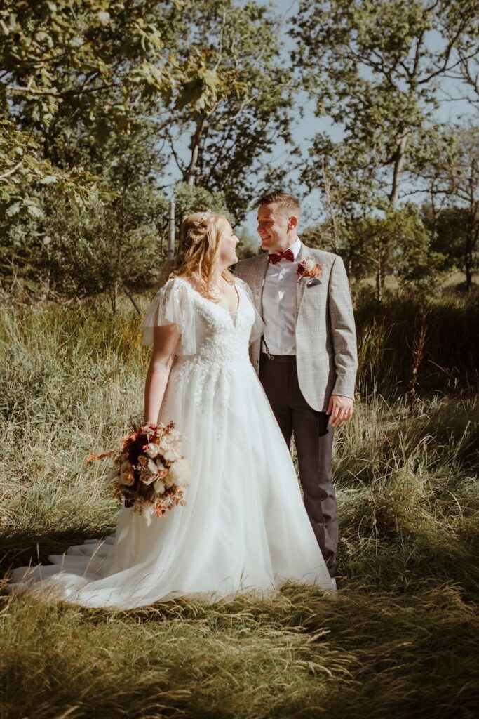 Outdoor wedding portrait showing natural fit of altered WED2B wedding dress