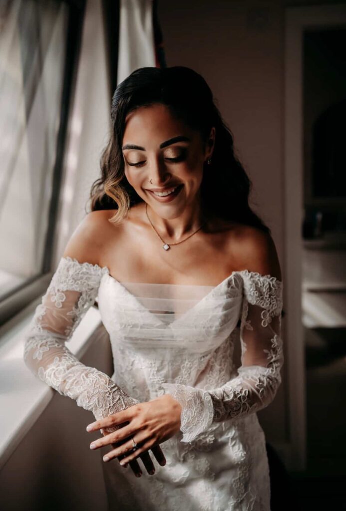 Beckenham bride wearing altered Martina Liana wedding dress with fitted lace sleeves during wedding close up of bride corset