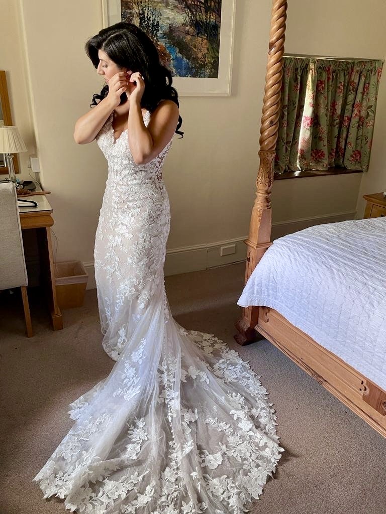 Allure Bridal alterations – bride getting ready in her perfectly fitted Allure Bridal wedding dress