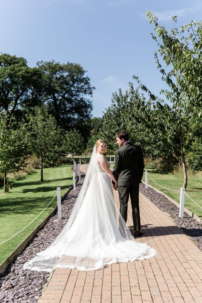 Redhill bride wearing altered Morilee wedding dress with groom 