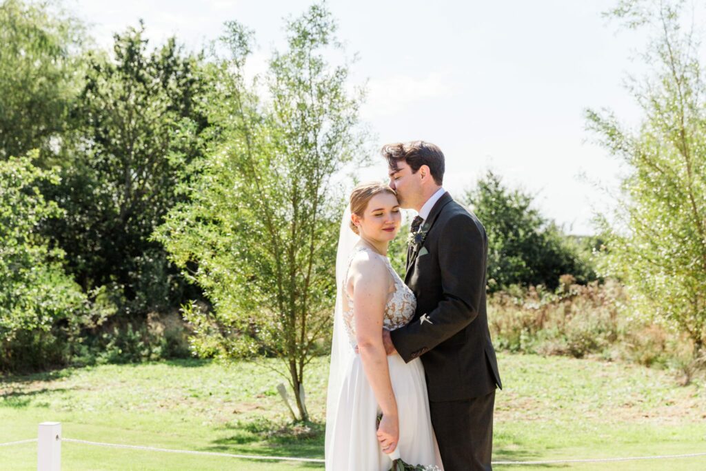 Bride and groom kissing