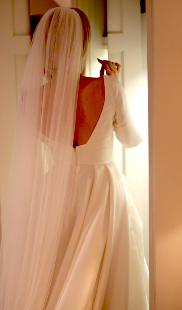 Leah Da Gloria Bennett wedding dress with bespoke sleeves created during bridal alterations cathedral veil detail