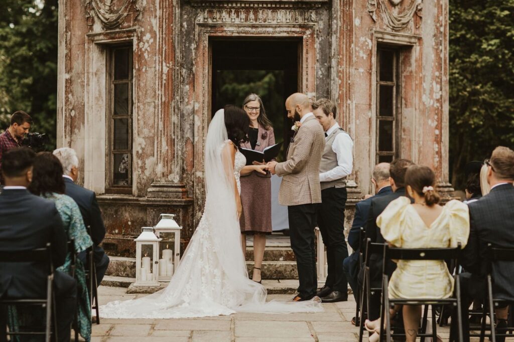 Allure Bridal alterations – bride and groom ceremony in her perfectly fitted Allure Bridal wedding dress