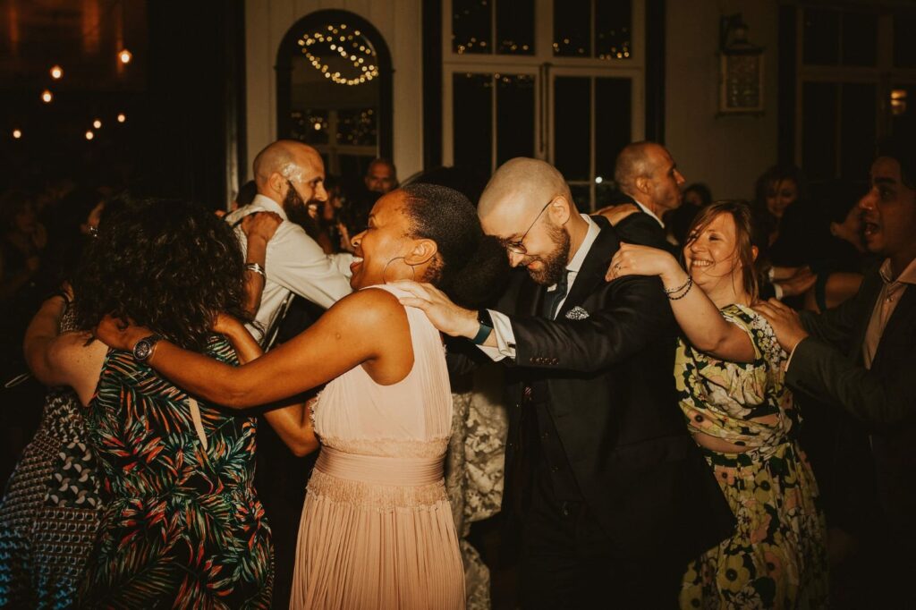 Guests joining the traditional Conga dance at the wedding reception