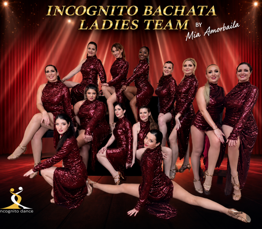Incognito Bachata Ladies Team wearing matching red sequinned performance costumes for a group dance performance.