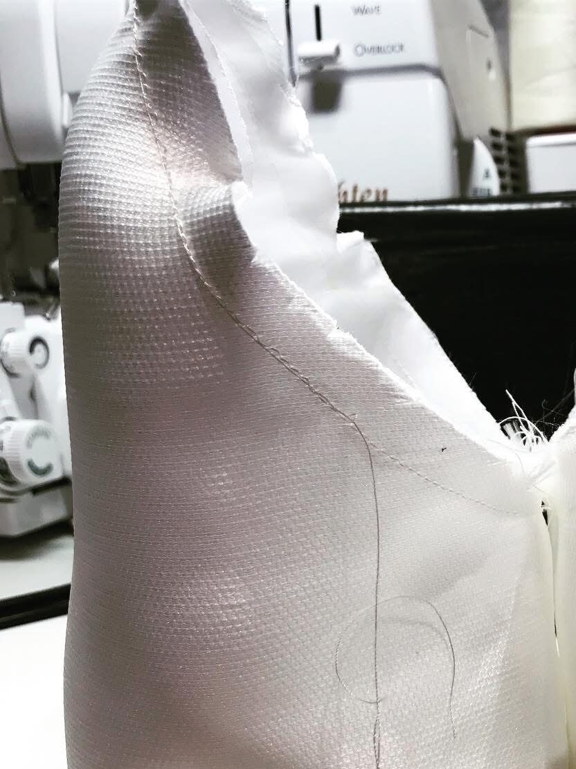the sleeve head construction and shaping pressing excess ease to shape sleeve head 