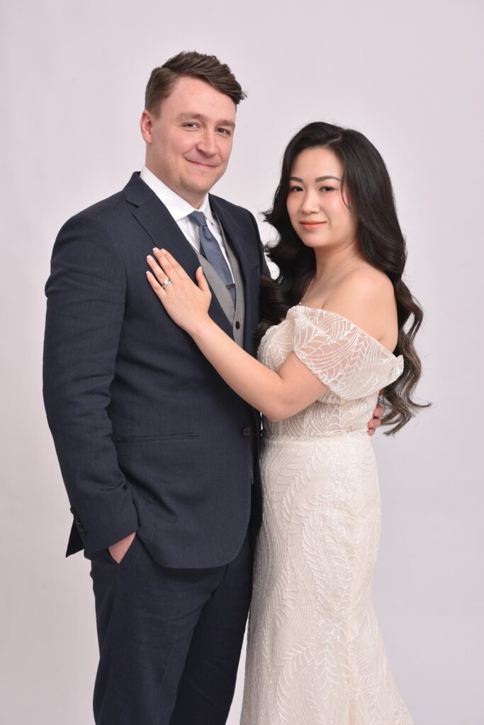 Petite bride wearing altered Monreal Lindsay wedding dress with bespoke Bardot sleeves and waist reconstruction