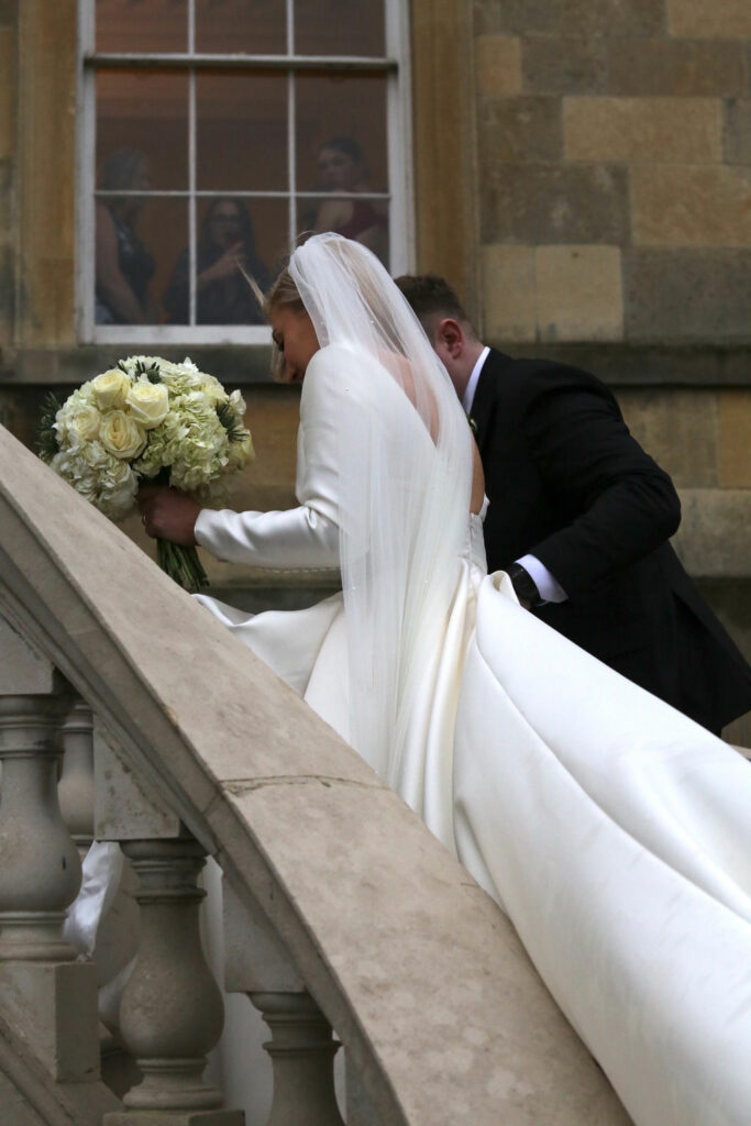 Custom drafted set-in sleeve on Leah Da Gloria Bennett wedding gown on steps cathedral veil
