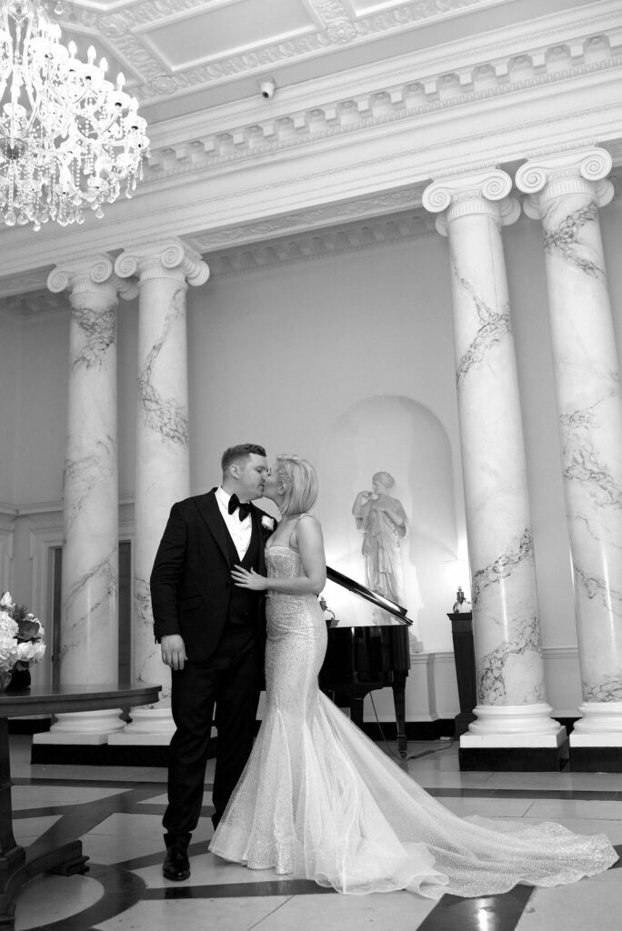 berta bridal alterations fitted like tye glove kissing at ceremony