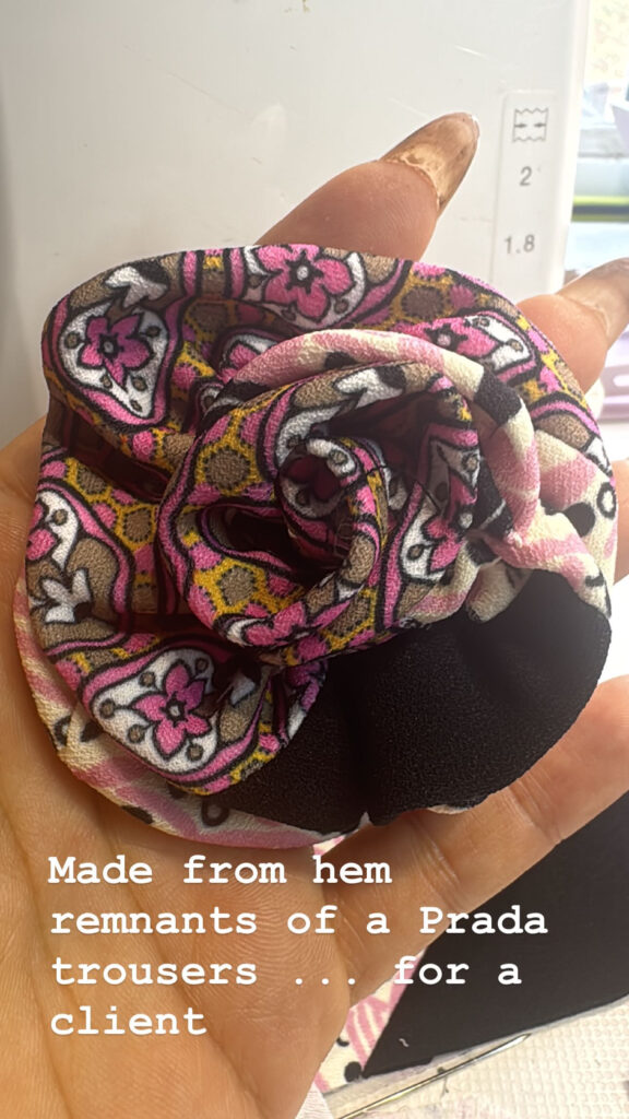 Handmade fabric flower created from Prada trouser alteration remnants