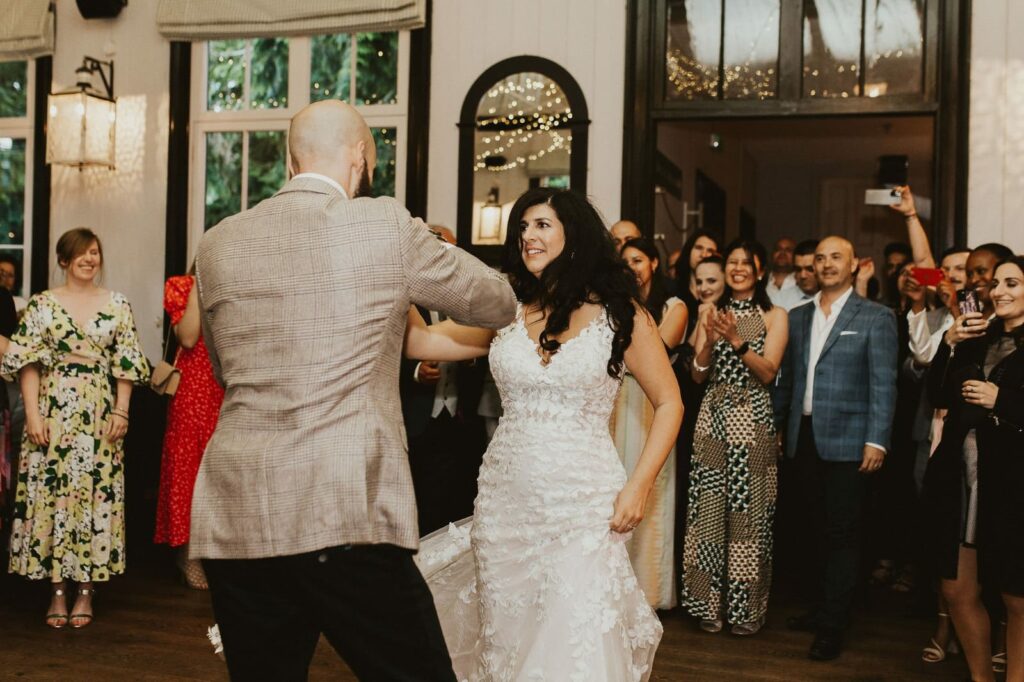 Bride and groom enjoying their first dance after couture bridal alterations salsa number 
