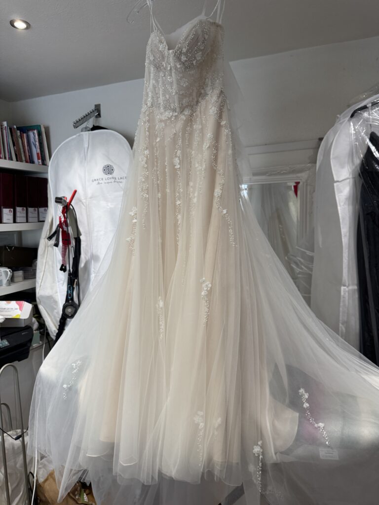 Bridal Alterations Tooting, Bride’s altered Justin Alexander Florita wedding dress ready for collection after final steam press.