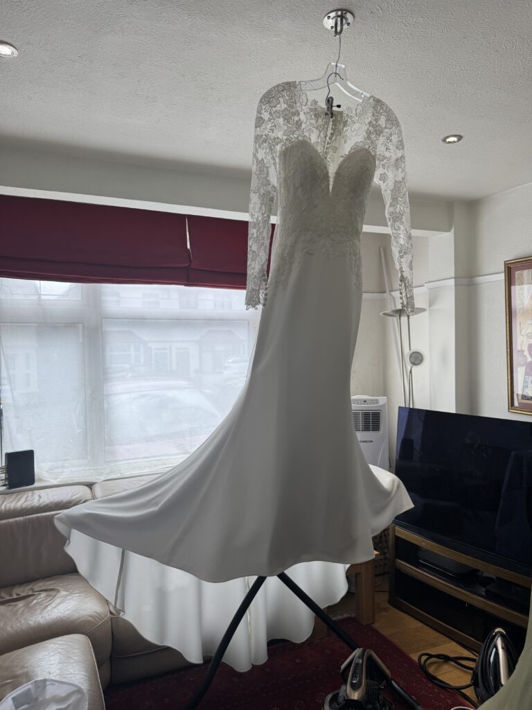 steam pressed and packed Elegant silhouette of a WED2B Fabien wedding dress after professional alterations