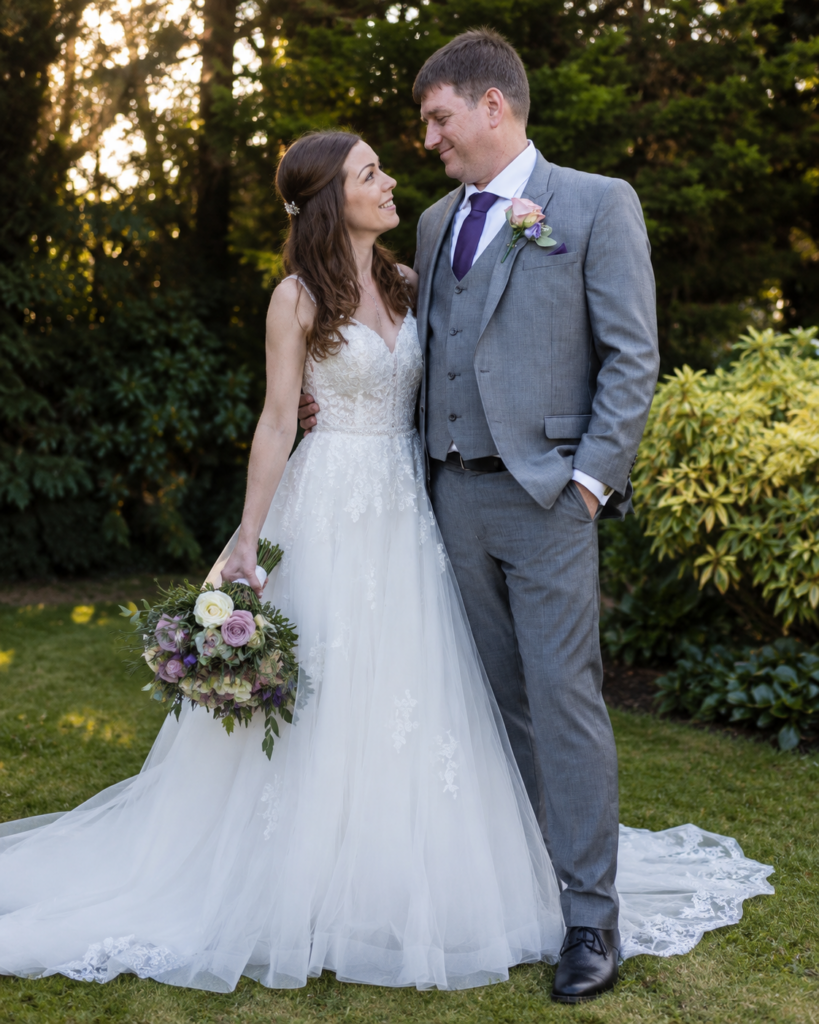 Stella York wedding dress customisation with crystal straps, rhinestone belt and hidden bra support addition of rhinestone embroidery to criss cross detail
