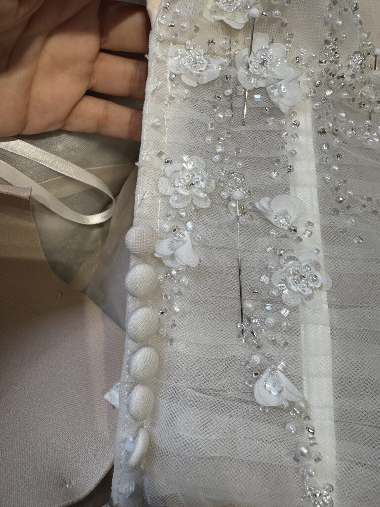 reduction of size 8cm from initial size of dress.