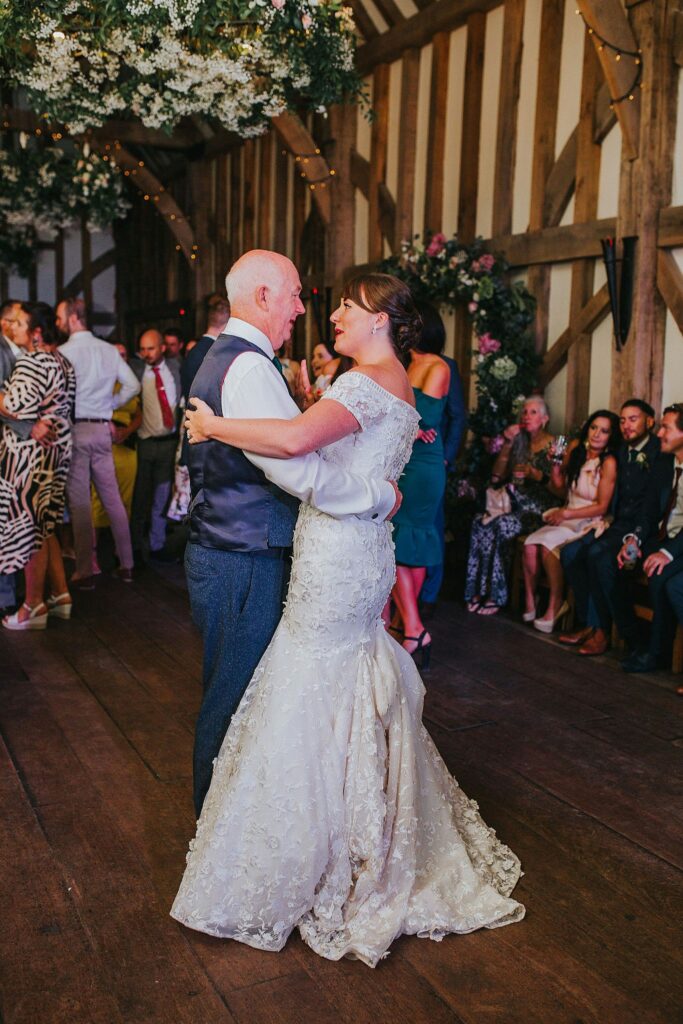 Bride wearing altered Anny Lin wedding dress showing 3 point American outer bustle during wedding Greater London Bride