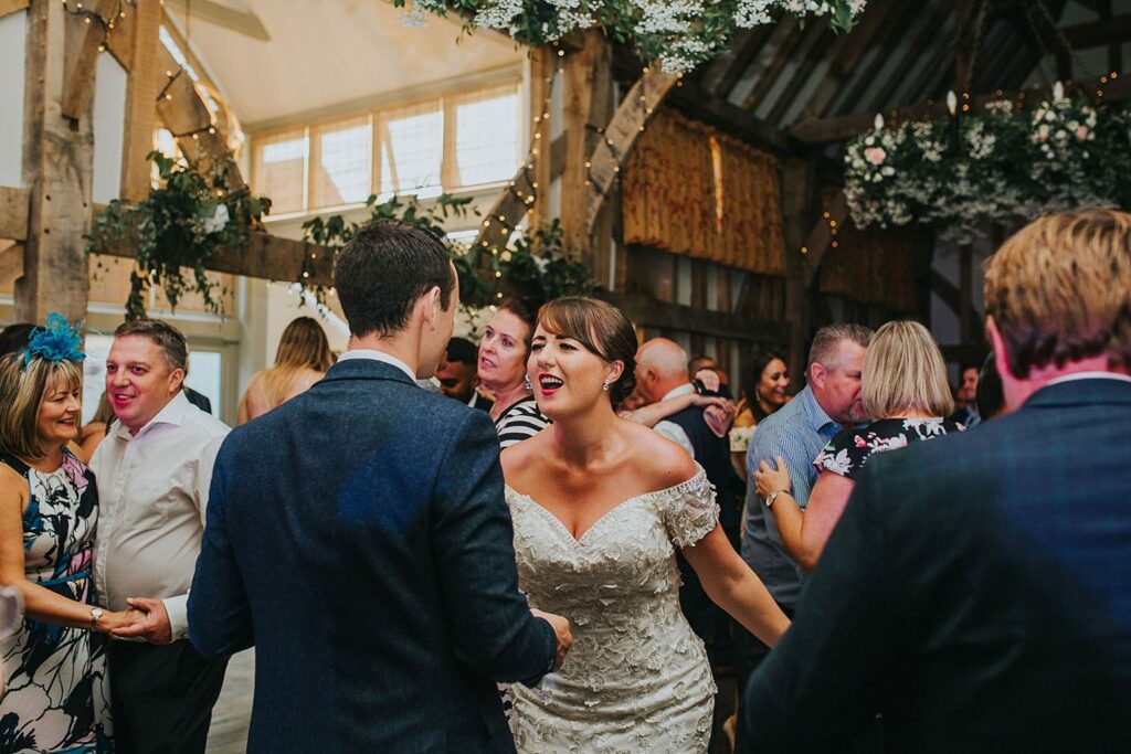Bride wearing altered bridal during Surrey wedding dance 