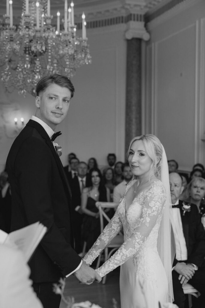 ceremony holding hands showing perfectly fitted skeeves alterations