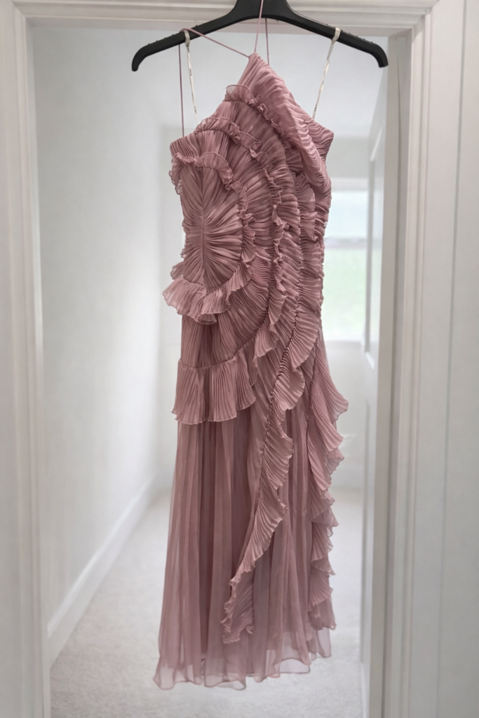 Amur designer dress alterations London with full three size reduction with a side zip fit pleats were also reconfigured and hem was all shortened to midaxi length from maxi