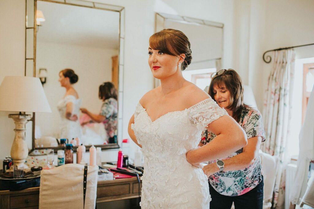 BRIDE by Aster bride preparing for her Surrey wedding before wearing her altered wedding dress