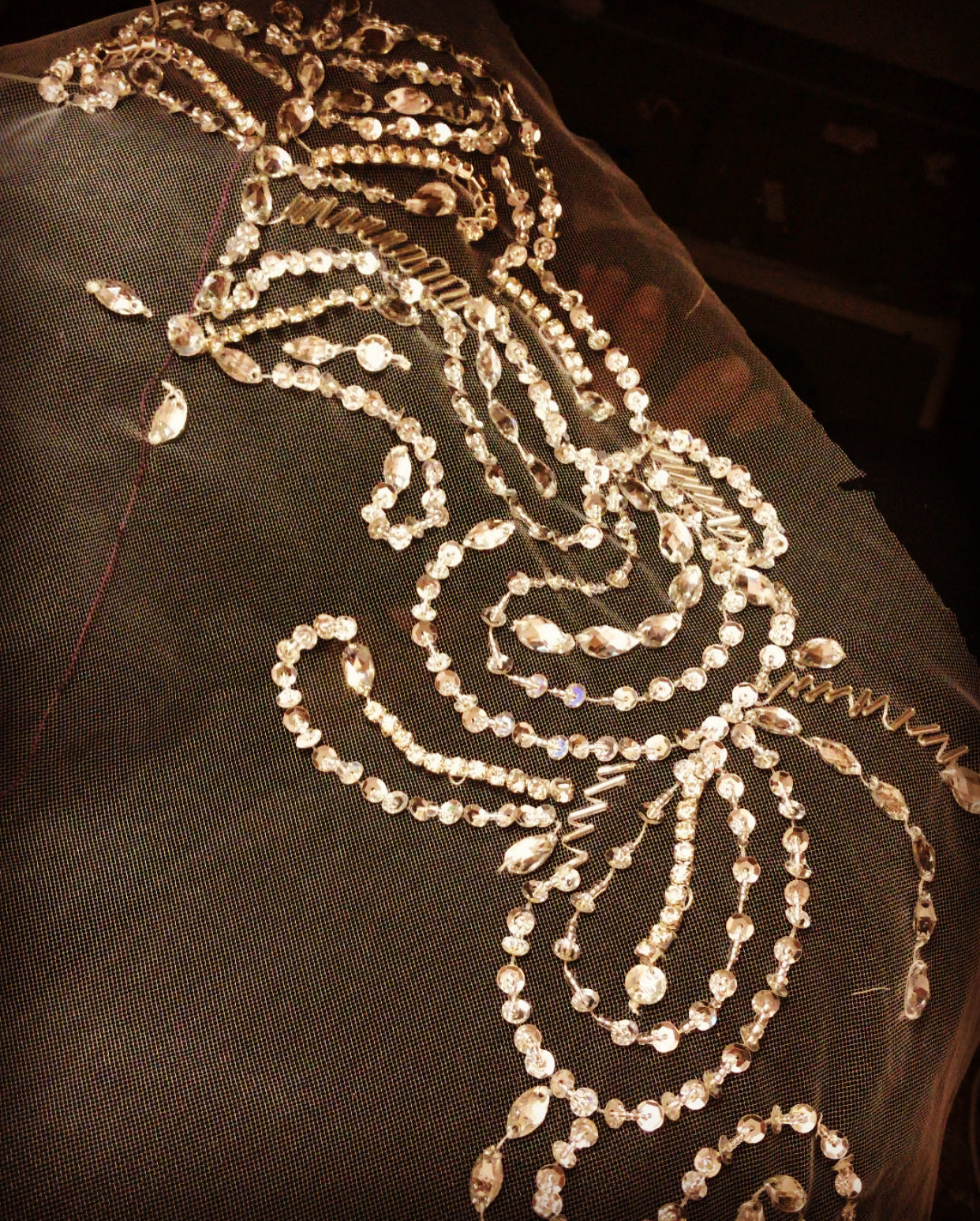 Couture crystal embroidery recreated by hand for bespoke illusion wedding dress sleeves details