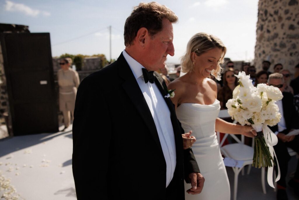 Bride walking down the aisle in a Duke by Khya Studios wedding dress following couture Khya bridal alterations