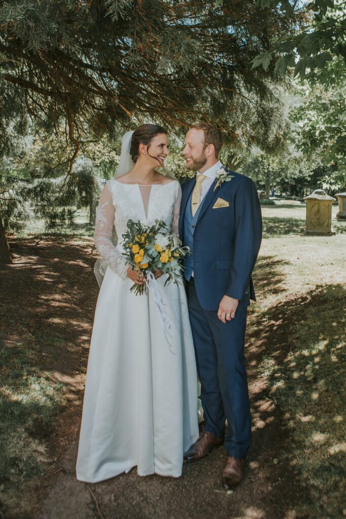 Bride wearing bespoke beaded lace bolero created for a Jesus Peiro wedding dress during her wedding day