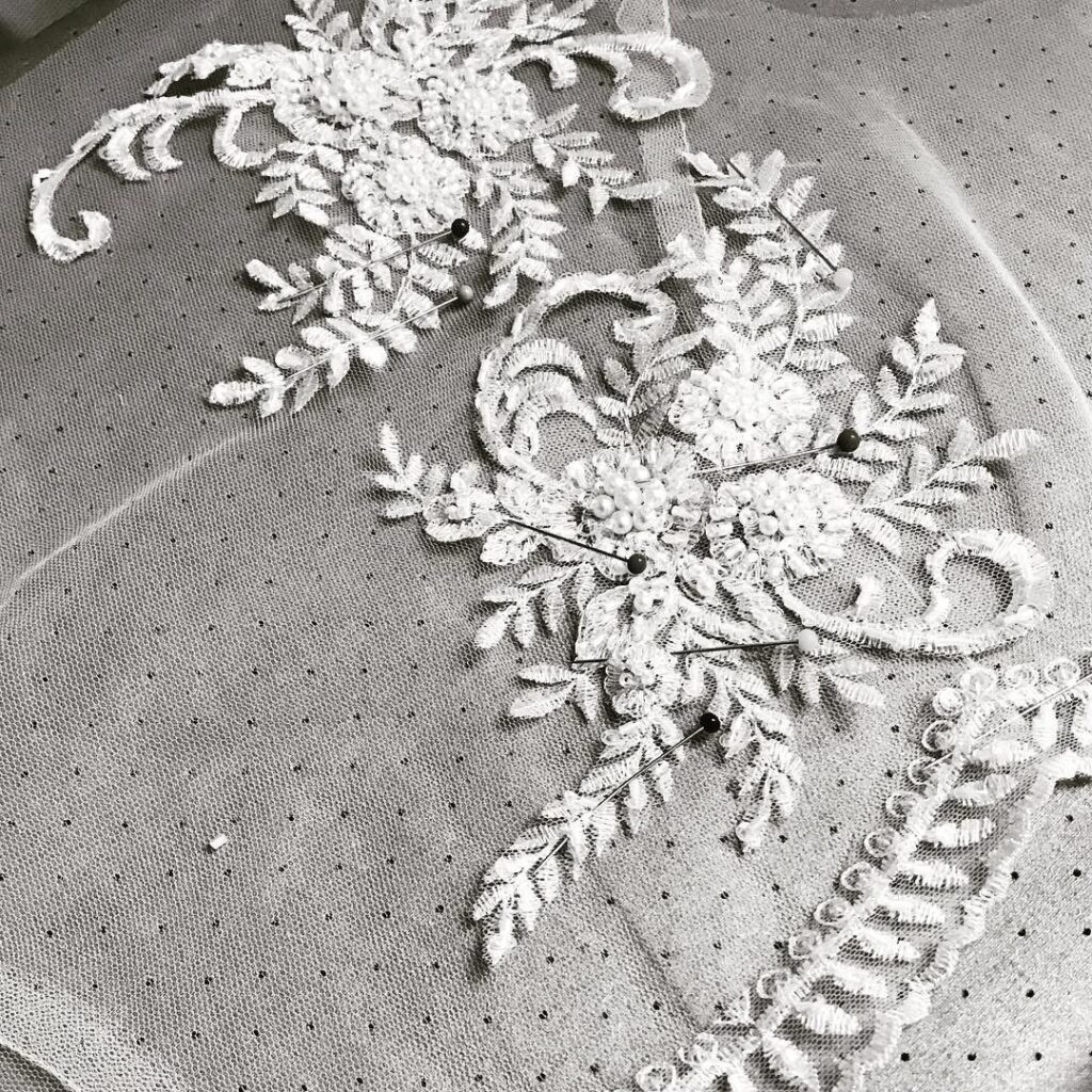 lace pieces cut individually for a bespoke illusion bridal bolero created from scratch