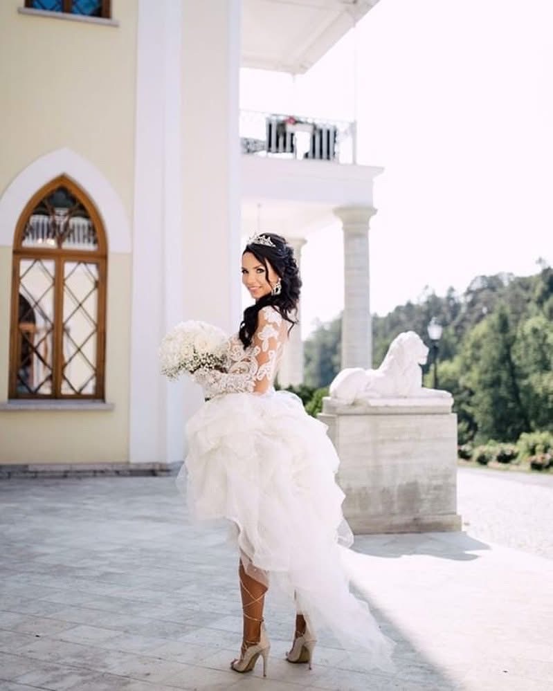 Close-up of Julia Kontogruni bridal alterations showing couture bodice contouring and illusion lace details with 50 bustles