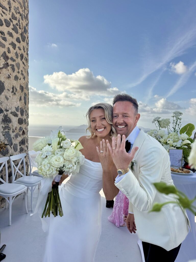 Bride celebrating after the ceremony wearing her expertly altered Duke by Khya Studios wedding dress.