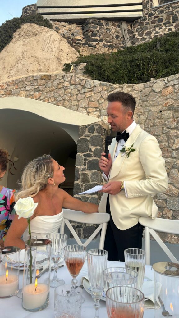Bride listening to grooms speech in a Duke by Khya Studios wedding dress following couture Khya bridal alterations