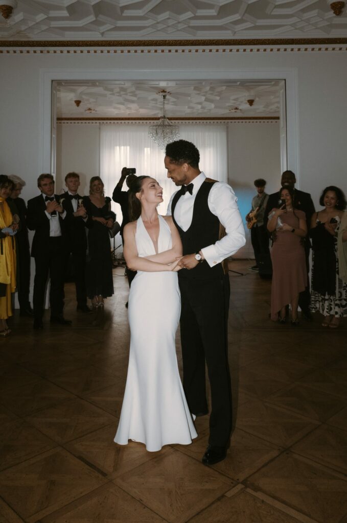 Bride and groom after Made With Love bridal alterations with the Audrey wedding gown perfectly fitted dancing