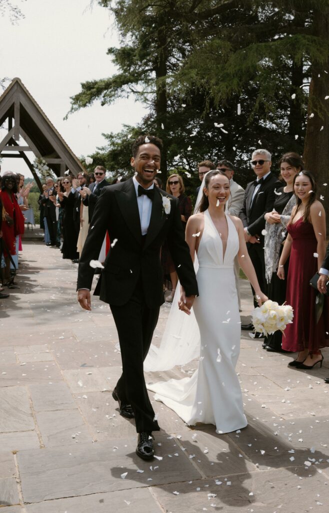 Bride wearing a Made With Love Audrey wedding dress after couture bridal alterations during the confetti celebration