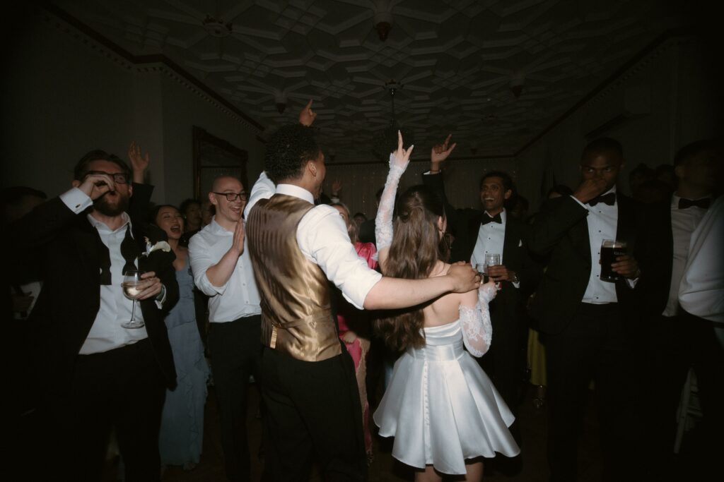 Bride and groom after Made With Love bridal alterations with the Celine Mini wedding gown perfectly fitted.