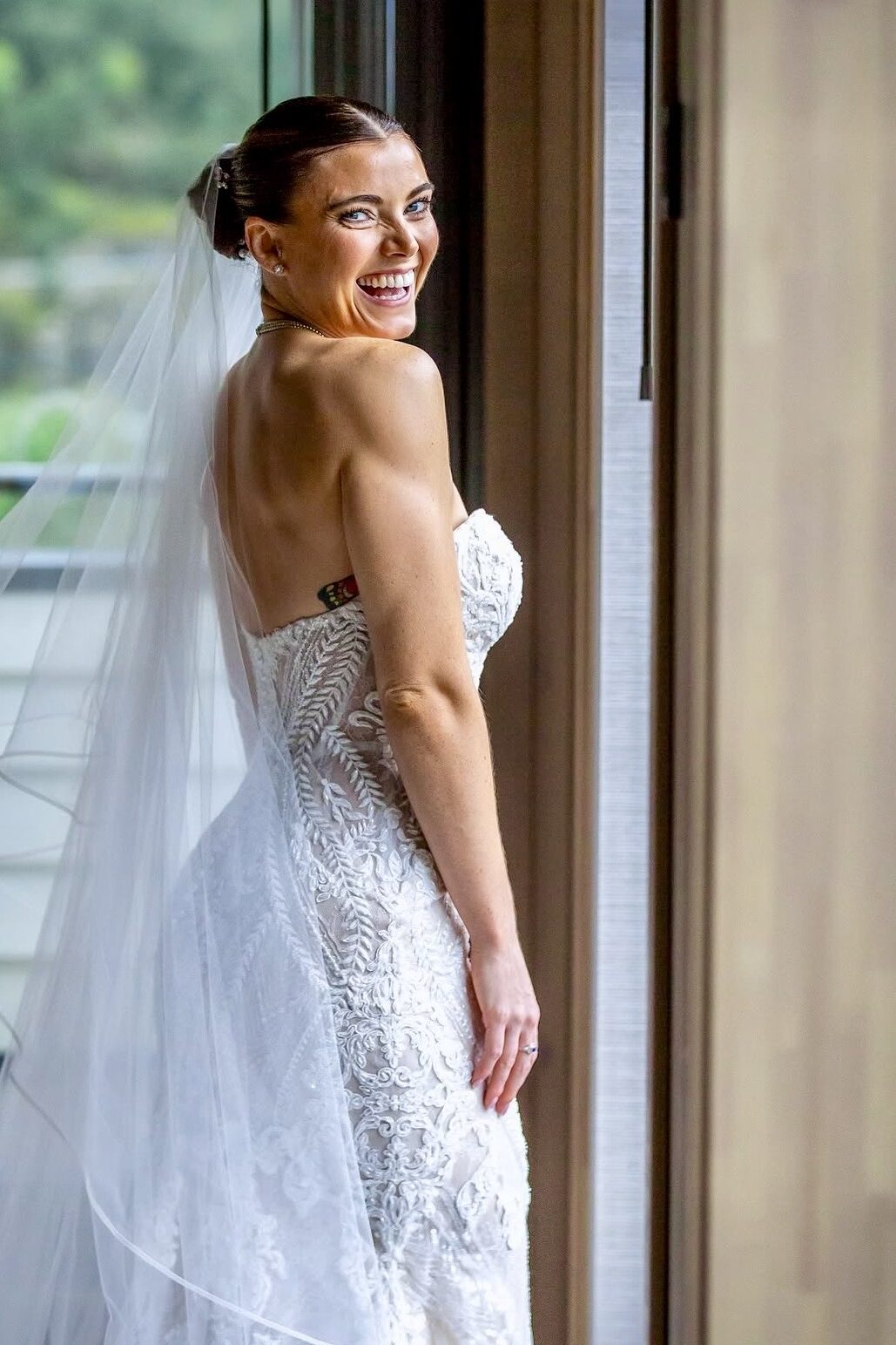 Bride wearing altered Martina Liana wedding dress with sculpted fit and hidden cup support close up