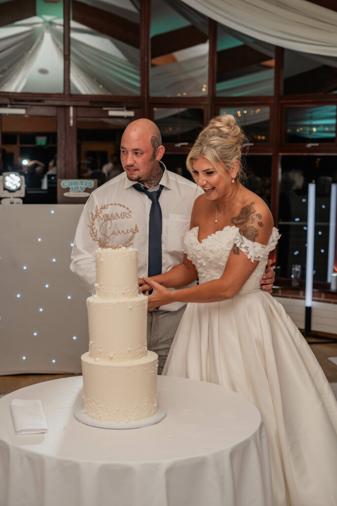 Anna Sorrano Bridal Alterations – Worcester Park bride wearing her altered WED2B Anna Sorrano wedding dress cake cutting 