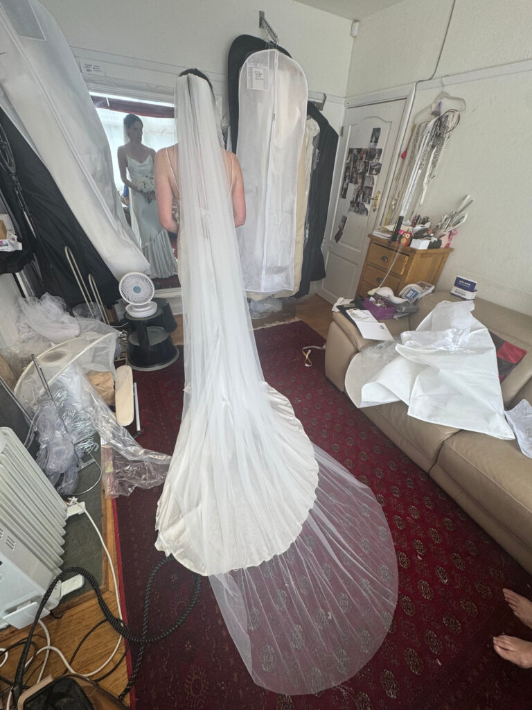 Clapham bridal alterations for a Grace Loves Lace Aura wedding dress after couture alterations back view with cathedral veil.