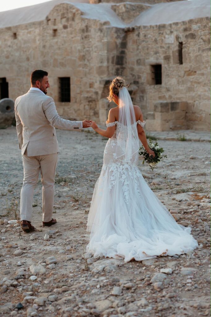 bride and groom walking away
