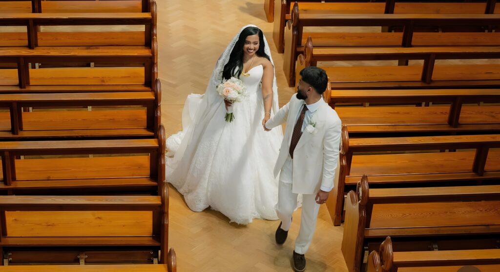 Bride wearing Allure Abella Carrington wedding dress after couture bridal alterations in Church.