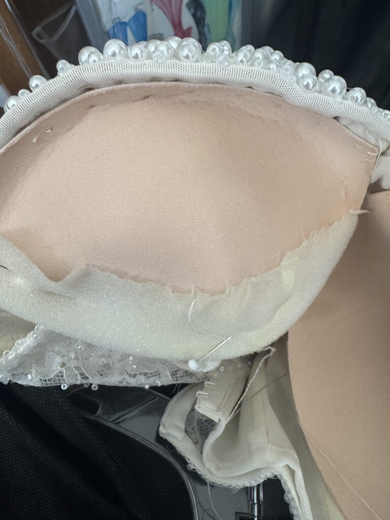 Interior couture construction showing added bust cups, under contour and over contour support inside the Milla Nova Bethel wedding dress..