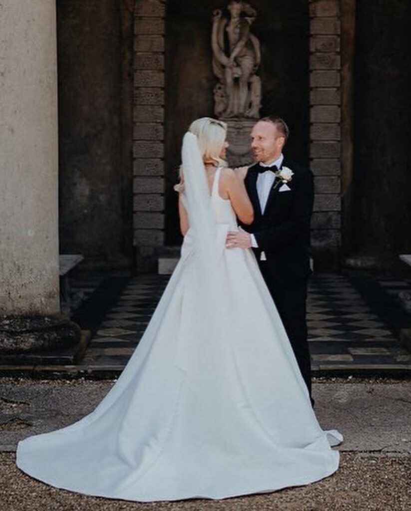 Elegant garden wedding portraits showcasing expert Mikado wedding dress alterations.