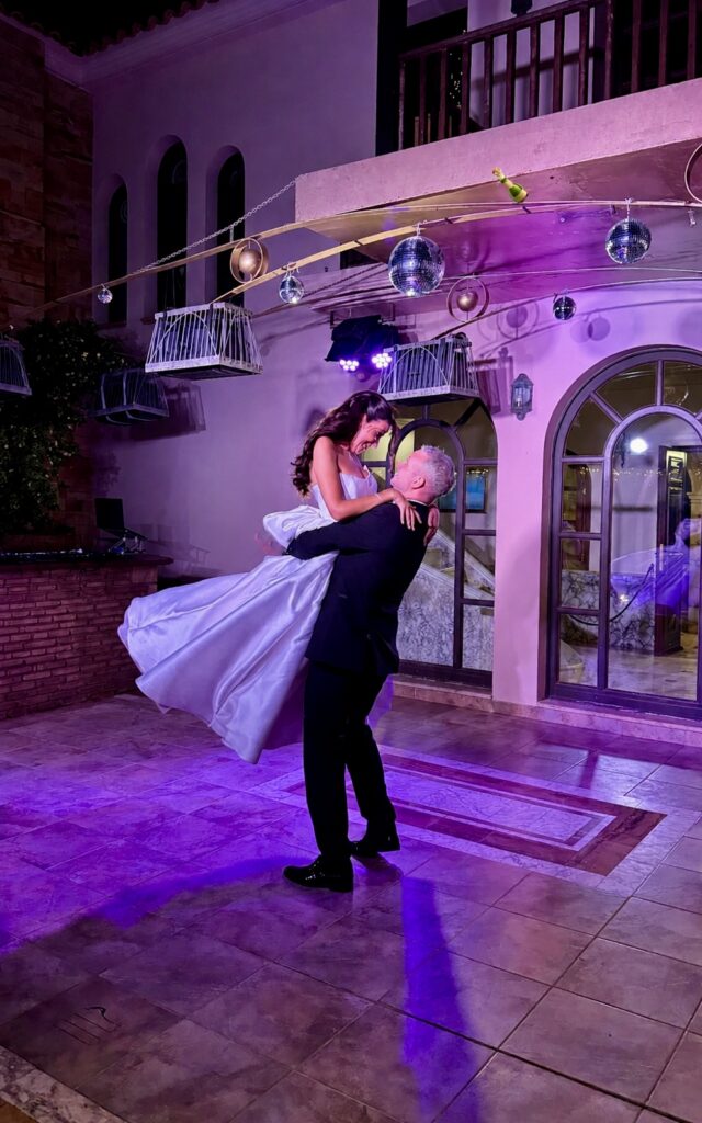 Bride wearing altered KYHA Studios Miles wedding dress after couture bridal alterations for an East Croydon bride dance floor showing 7 point American bustles.